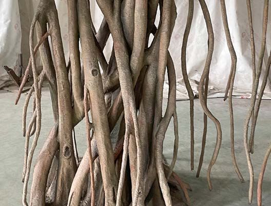 Hanging aerial roots of an artificial banyan tree
